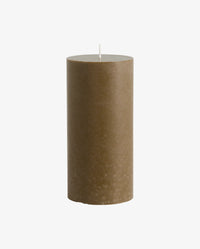 row of lit Nordal pillar candles on a white mantelpiece shelf, two tall cream candles, a shorter cream candle, two dark olive green candles of varying heights, another tall cream candle and a small dark candle, with framed artwork on the wall behind