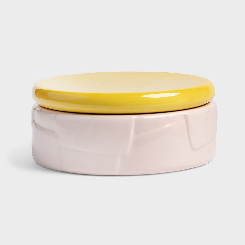 alt text: pink dolomite jar with sculptural pattern and bright yellow airtight lid &k Amsterdam