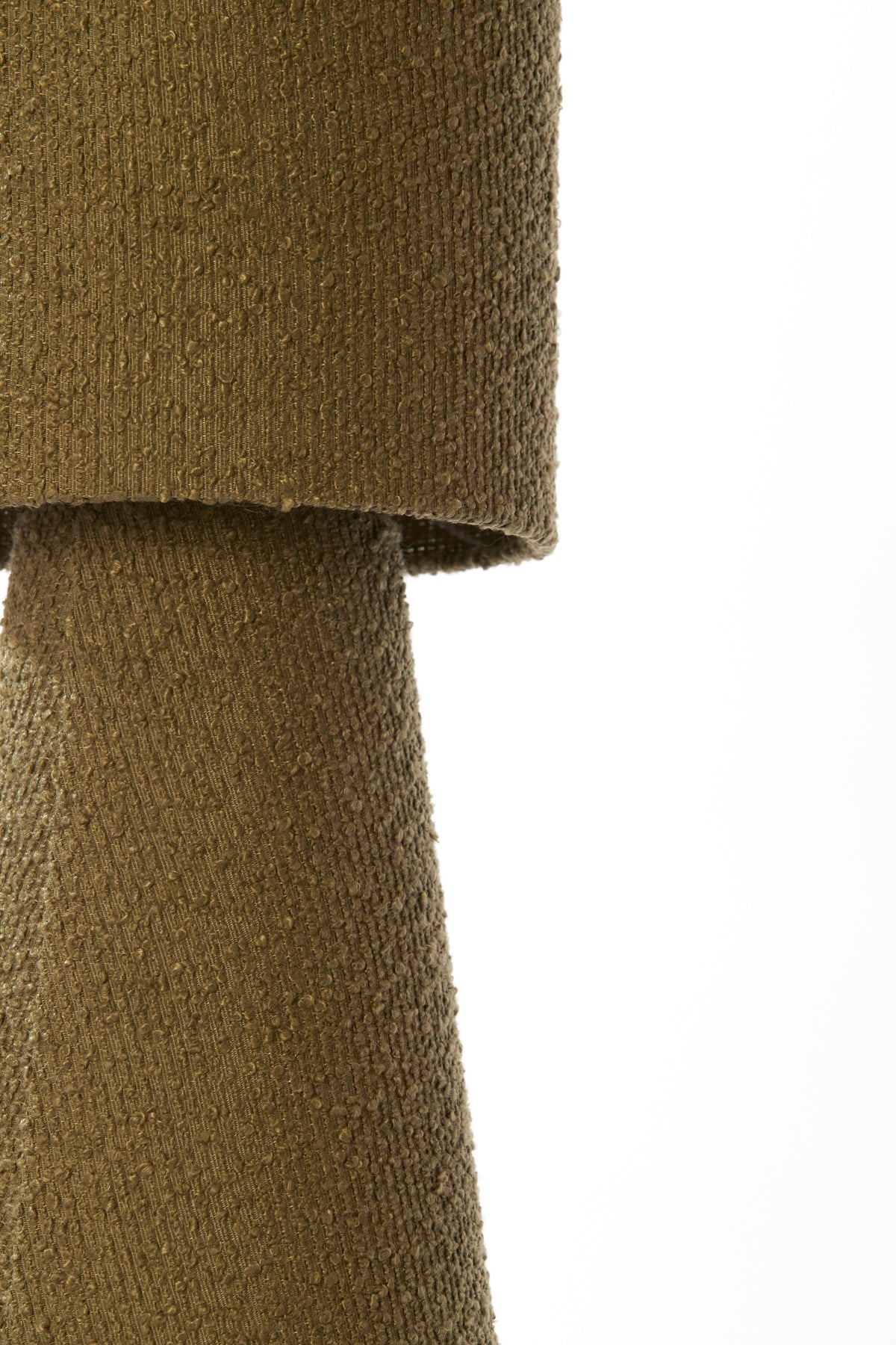  close-up of olive green boucle table lamp shade with textured fabric
