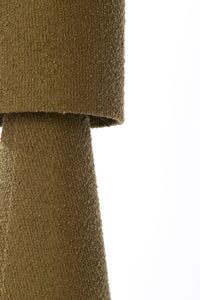 close-up of olive green boucle table lamp shade with textured fabric
