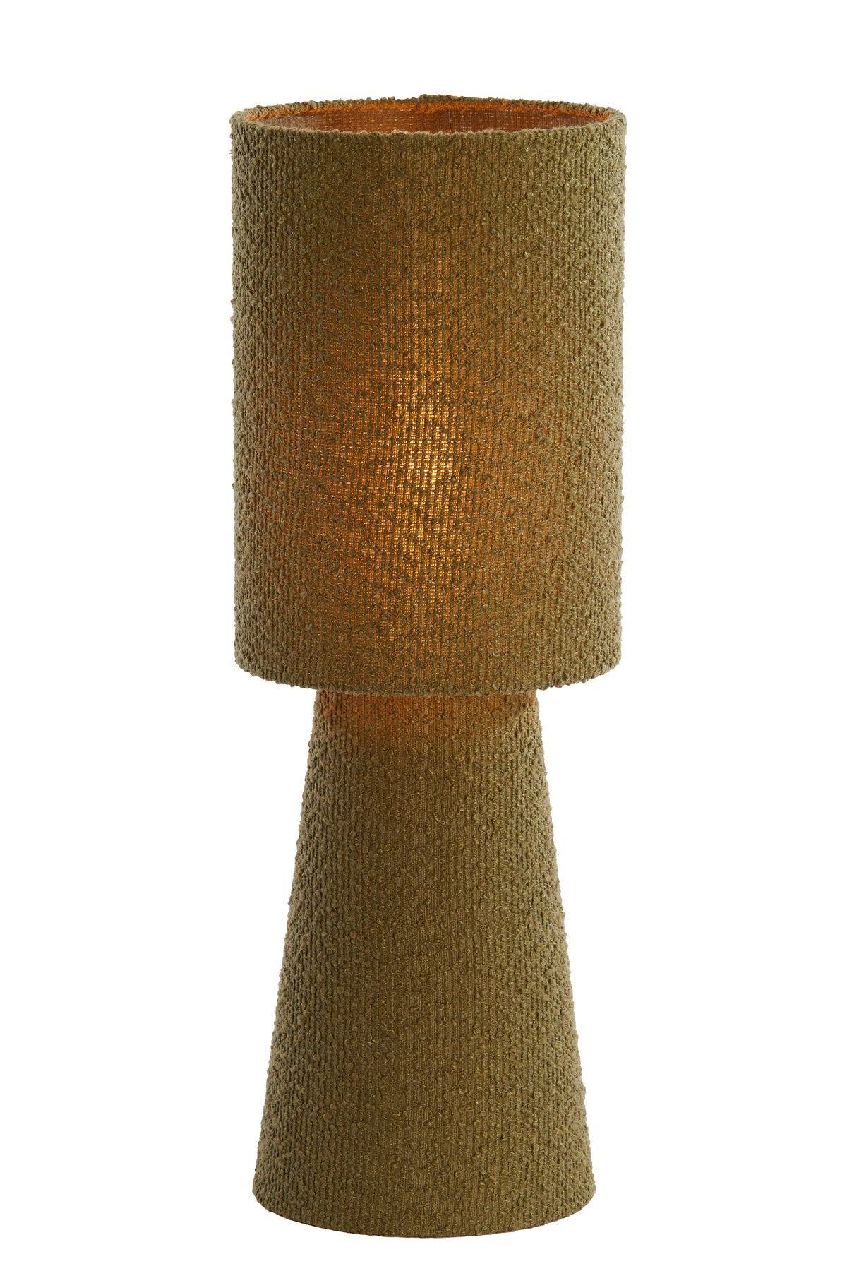 olive green boucle table lamp glowing warmly when switched on
