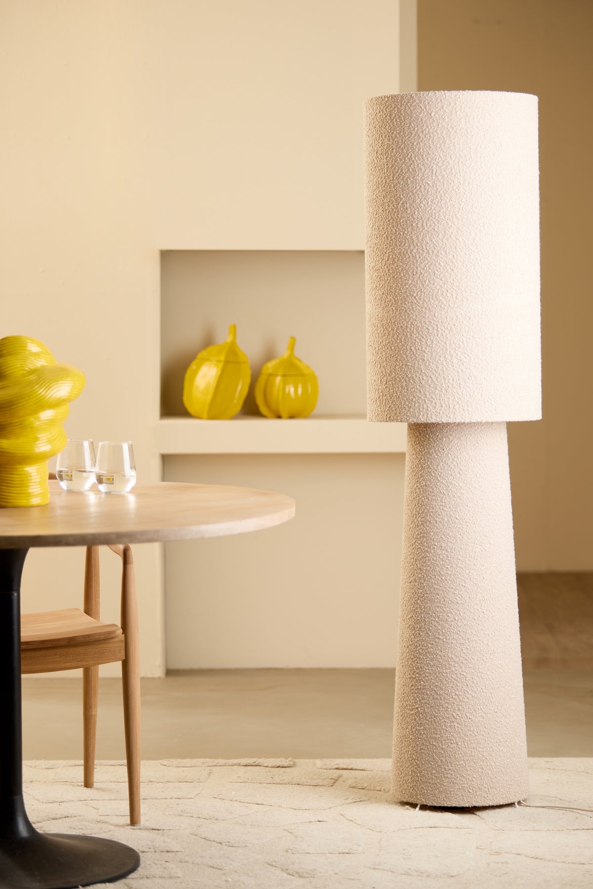 cream boucle floor lamp styled in a modern living or dining room
