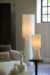 cream boucle floor lamp styled in a modern living or dining room
