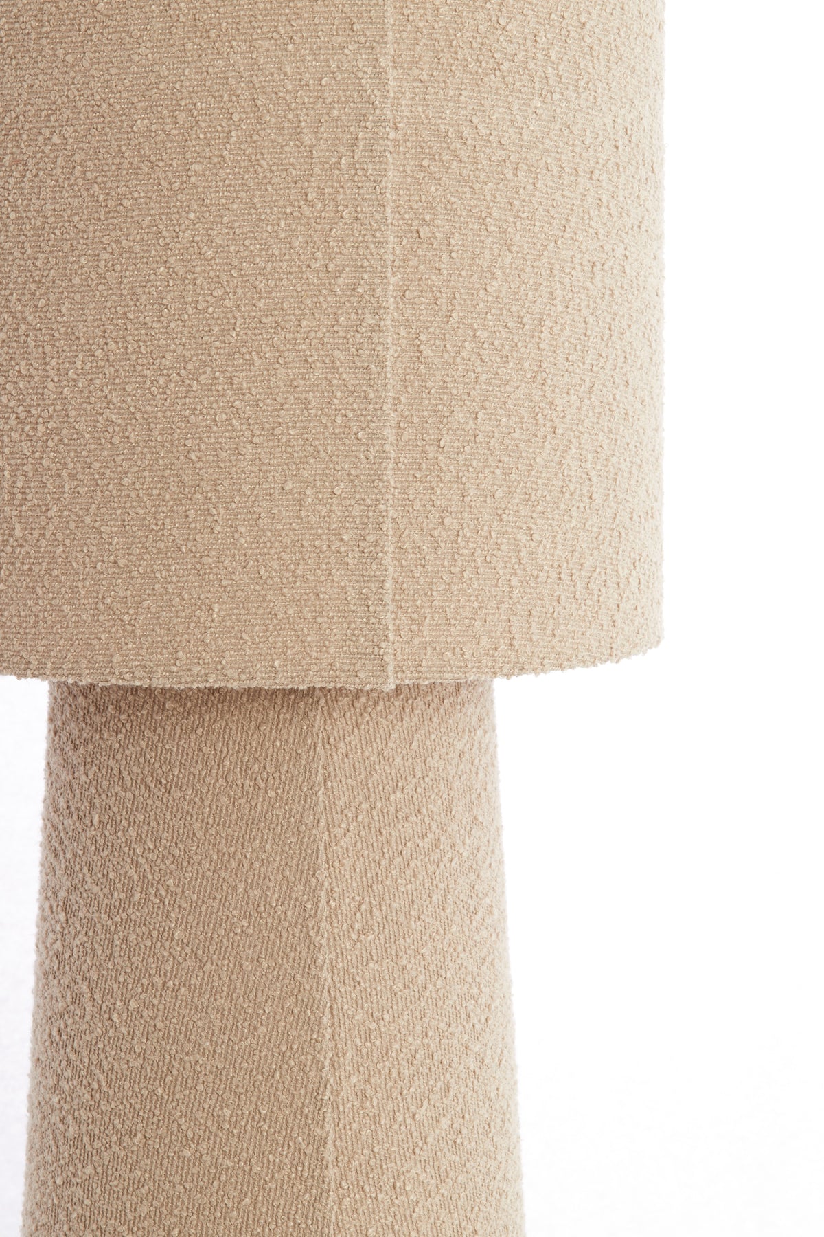 close-up of sand boucle fabric on floor lamp shade and base
