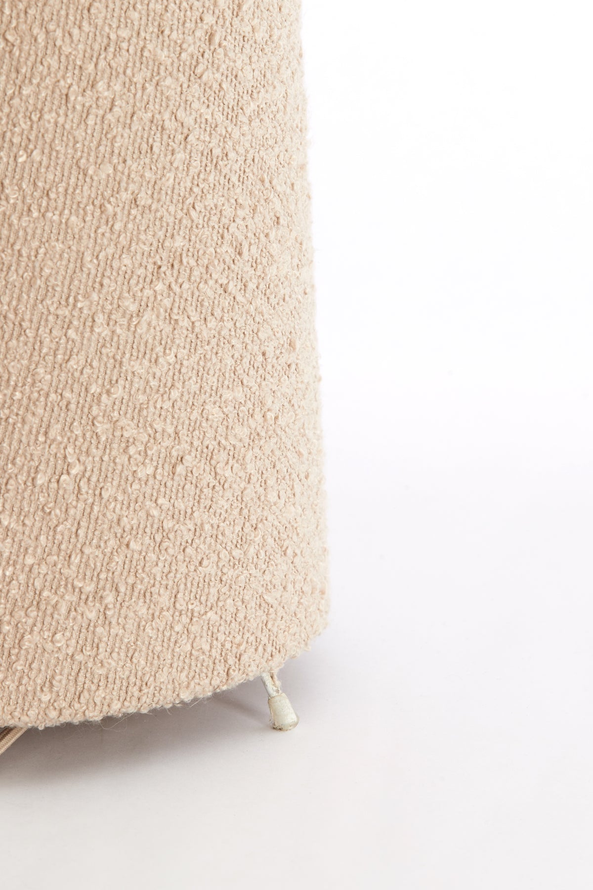 Beige textured floor lamp on a white background