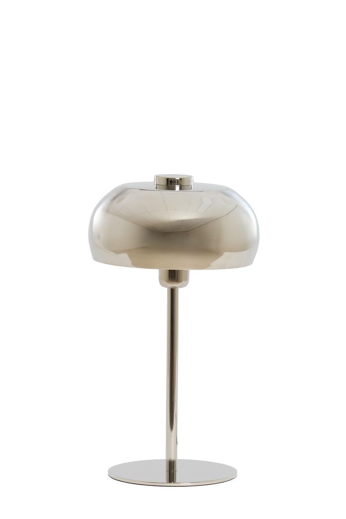shiny nickel table lamp styled on a console for modern interiors
