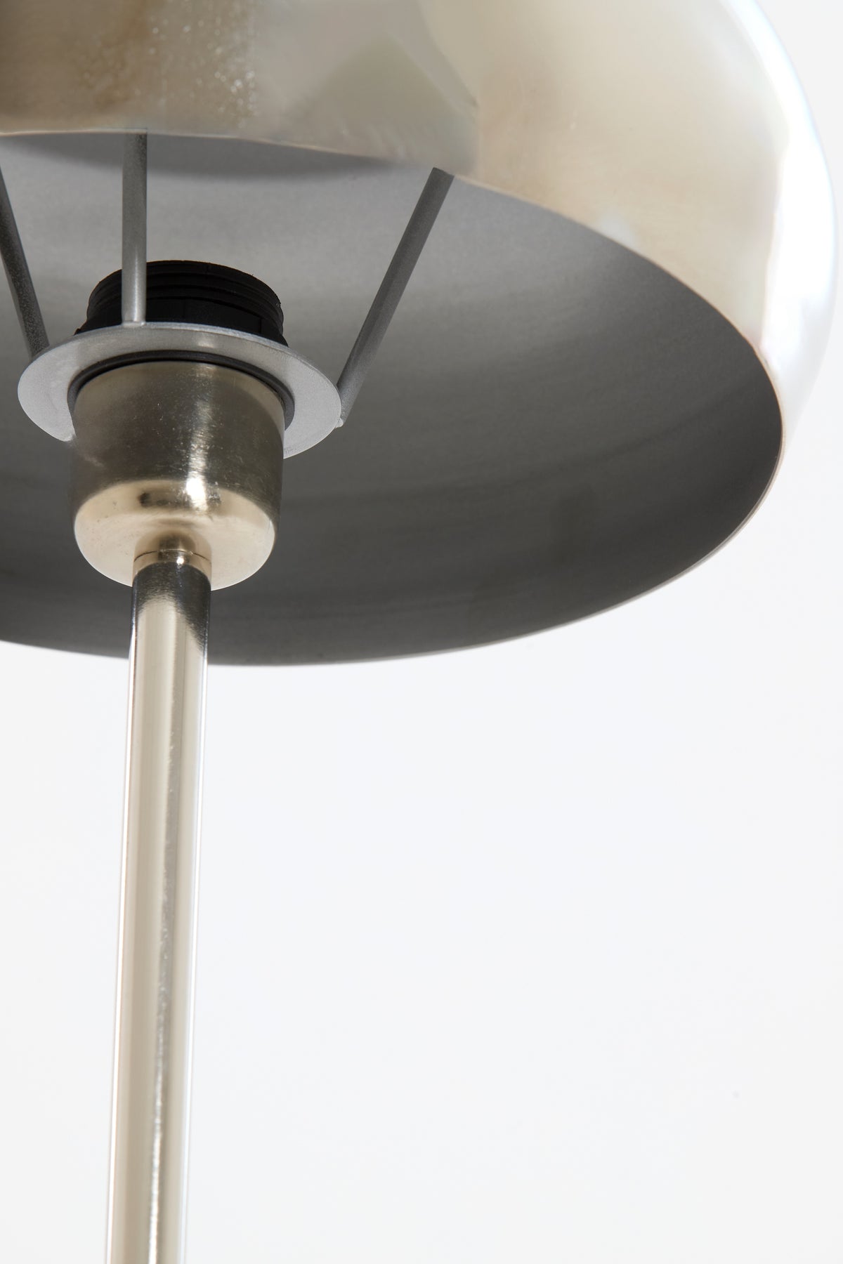 underside of chrome dome lamp shade showing structure and fittings
