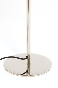 round chrome base of Surin table lamp with black fabric cable
