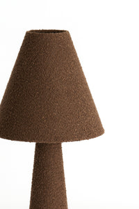 Close-up of brown bouclé fabric on the DEVIA floor lamp shade.
