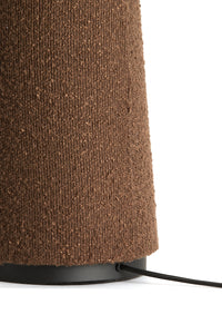 Detail of the textured bouclé base on the DEVIA brown floor lamp.
