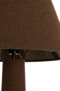 Close fabric detail highlighting the bouclé texture of the brown DEVIA lamp.
