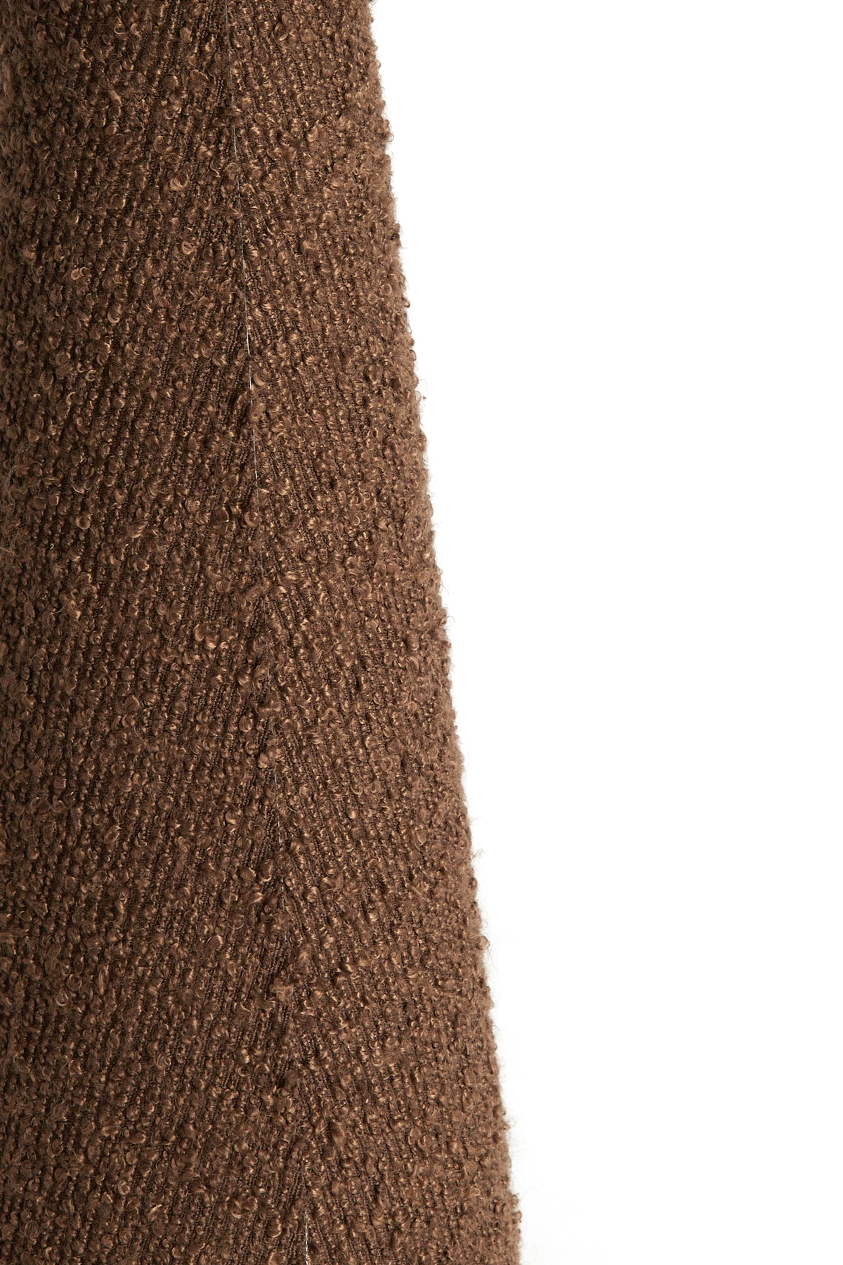 Lower base and cable detail of the DEVIA tall bouclé floor lamp in brown.
