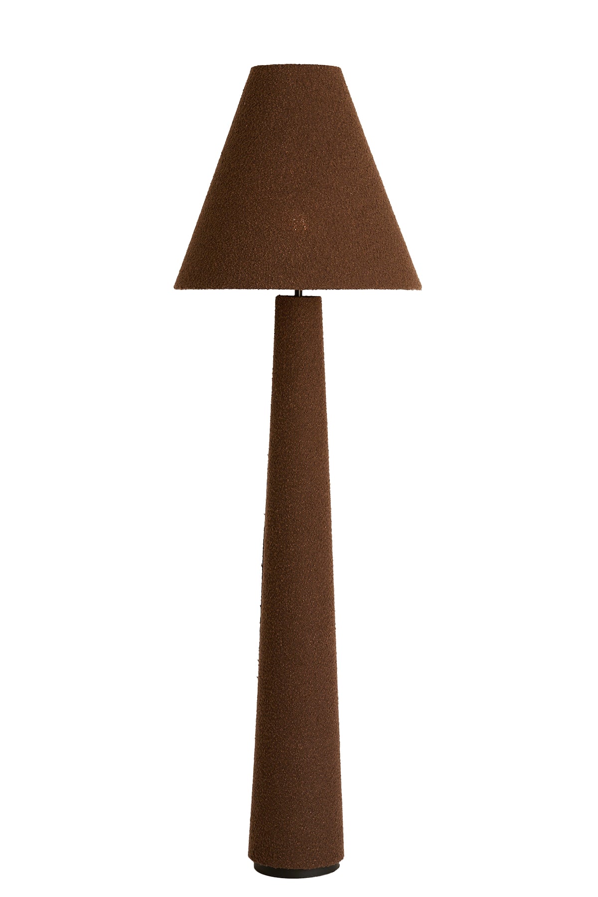 DEVIA tall brown bouclé floor lamp styled in a warm interior setting.
