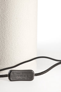 Black electrical cable with a plug on a white background