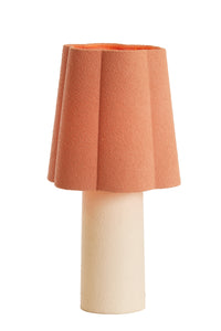 pink table lamp with textured fabric shade and sculptural round shape by Light & Living
