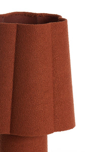 textured fabric lampshade in burnt orange with soft curved form
