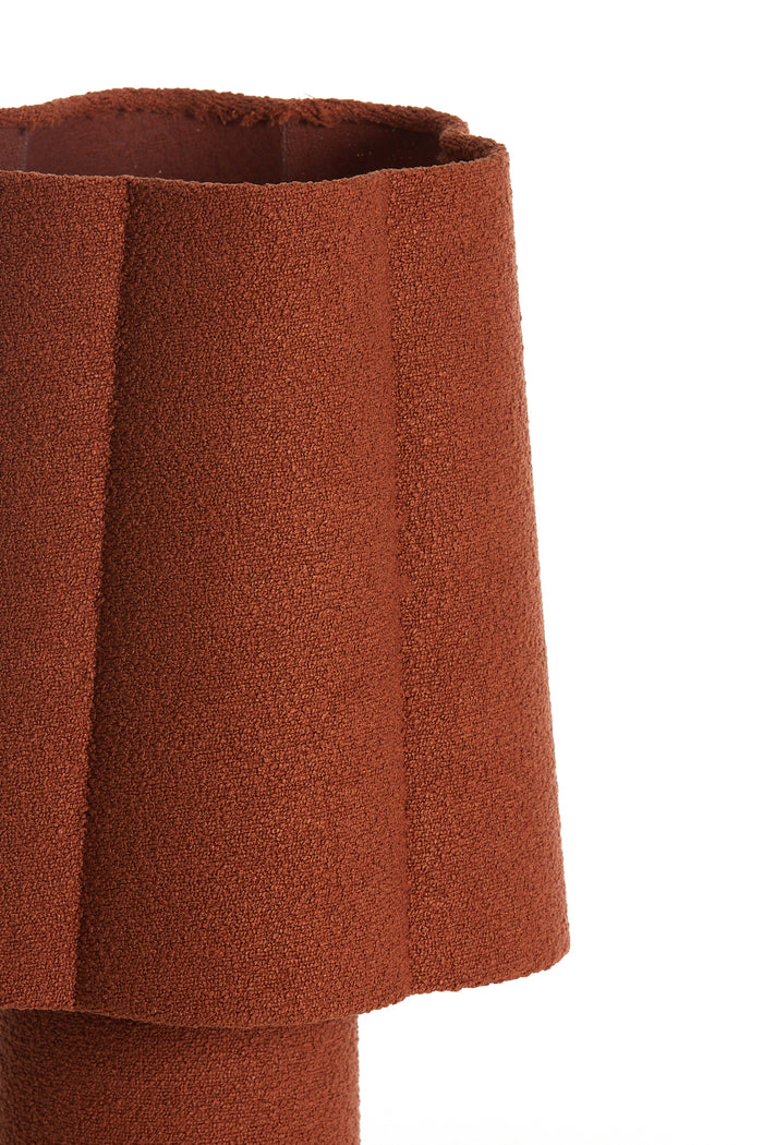 textured fabric lampshade in burnt orange with soft curved form
