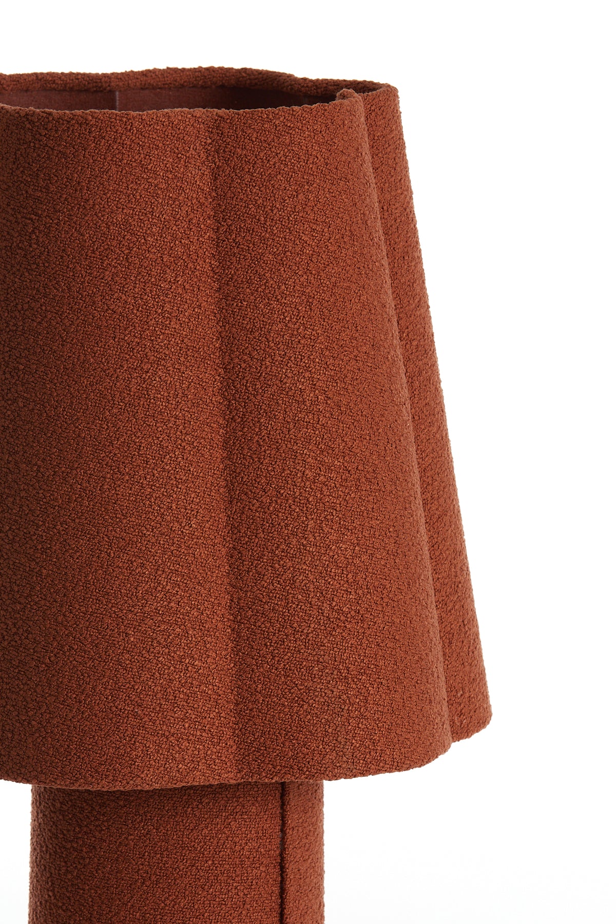 sculptural fluted shade of orange mushroom lamp in textile finish
