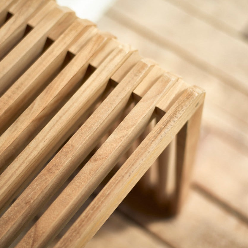 Contemporary teak bench with slatted design by hkliving