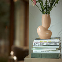 beige vase with an almost kidney bean shape from HKliving