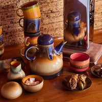 hkliving afternoon coffee pot with an electric blue lid dripping colour down the brown and beige body