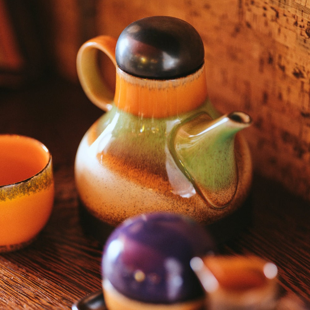 hkliving coffee jug with black lid and grass green round the middle and burnt orange and red in the lower bulbous with a thin spout