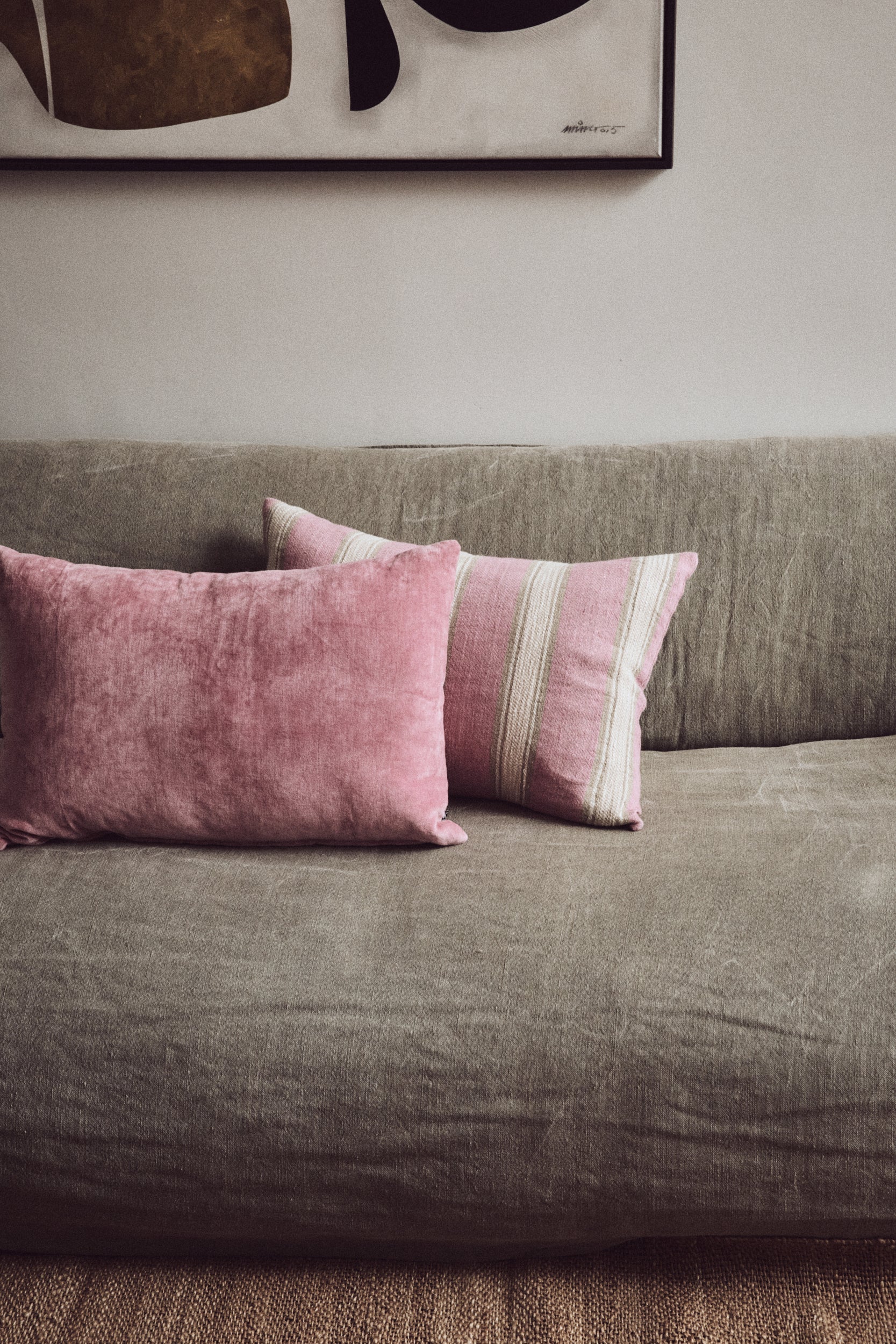 HKLIVING woven striped cushion in blush pink and cream, 60x40cm linen-cotton blend, styled on sofa
