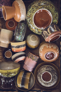 Collection of various HKLIVING ceramic bowls and plates with different textures and colours.