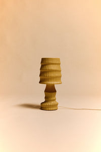 HKLIVING ribbed ceramic table lamp in ochre, shown against a soft pink background
