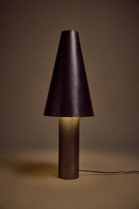 HKLIVING metal cone table lamp lit, glowing warmly against a dark brown backdrop