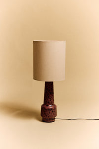 Close-up of the HKLIVING natural linen cylinder lamp shade fitted on a blue speckled ceramic lamp base