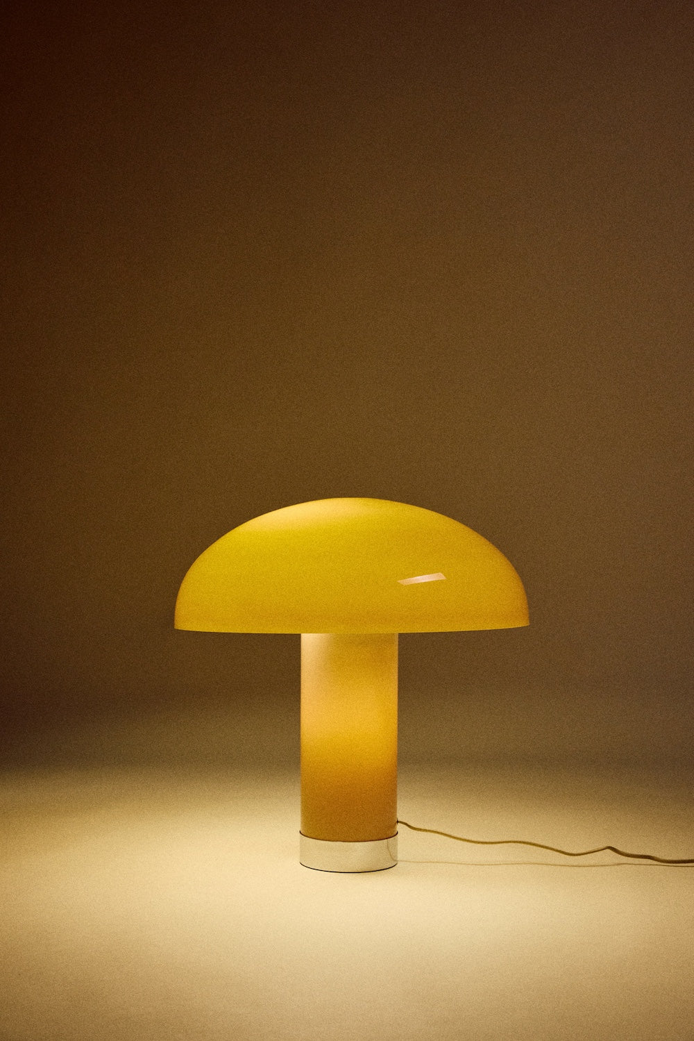 HKLIVING mocha lounge table lamp lit, the mushroom shade and column glowing warmly against a dark backdrop