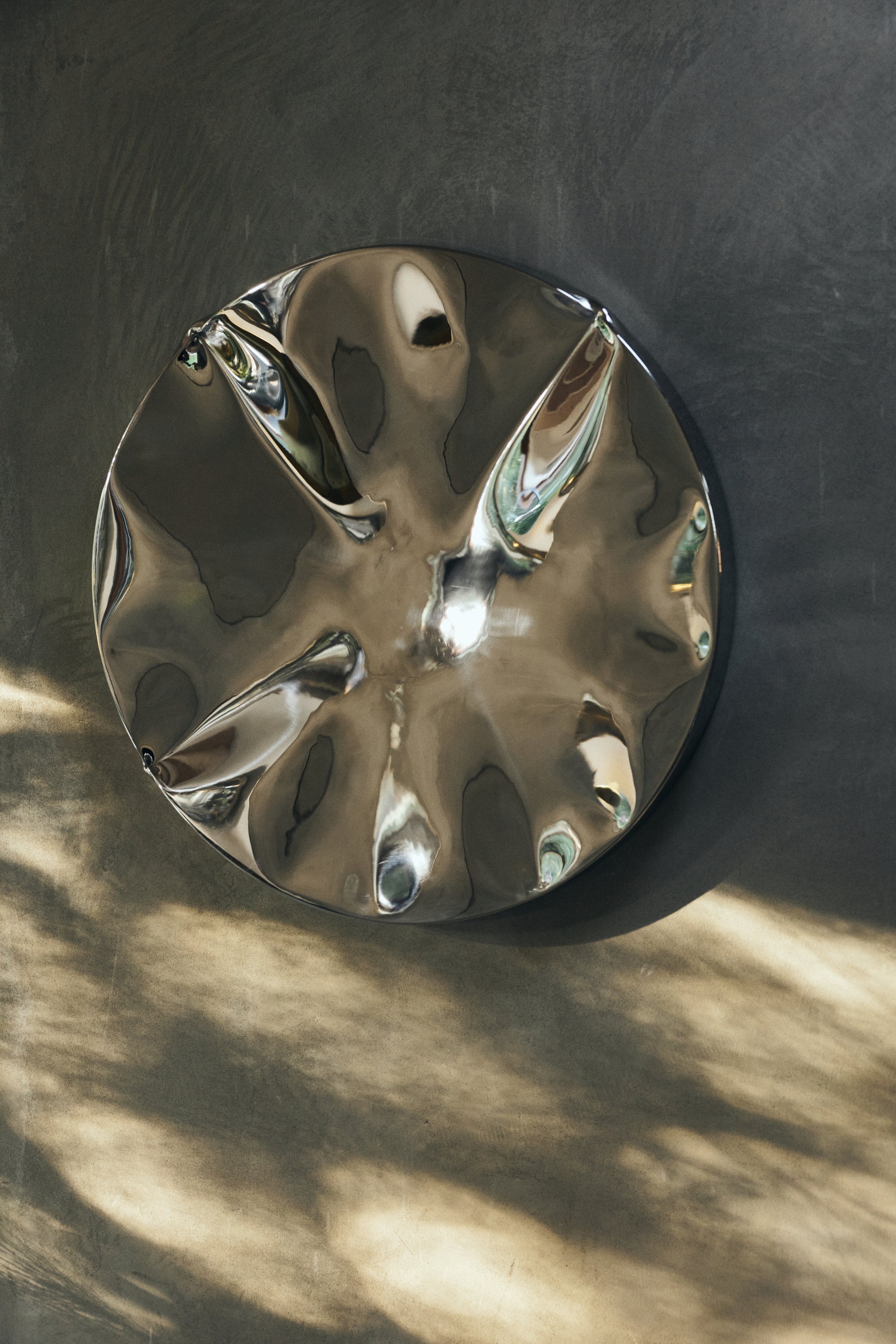 Abstract chrome wall art by HKLIVING in a minimalist home setting