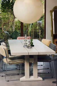 Dining room with Nienke Sikkema glass candle holders on the table under a paper pendant light