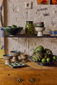 70s Ceramics Egg Tray in Minty displayed on open shelving alongside speckled bowls and other 70s Ceramics pieces