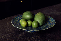 70s Ceramics Footed Fruit Bowl in Noise by HKLIVING styled on an open shelf beside other footed 70s ceramics bowls