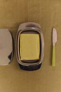 HKLIVING lemon butter knife beside a butter dish on a warm-toned table