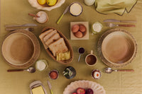 Breakfast table seen from above with bread, eggs, ceramics and HKLIVING 70s Cutlery
