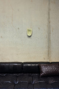 HKLIVING Glass Wall Sculpture in Cream mounted on a concrete wall above a dark leather sofa