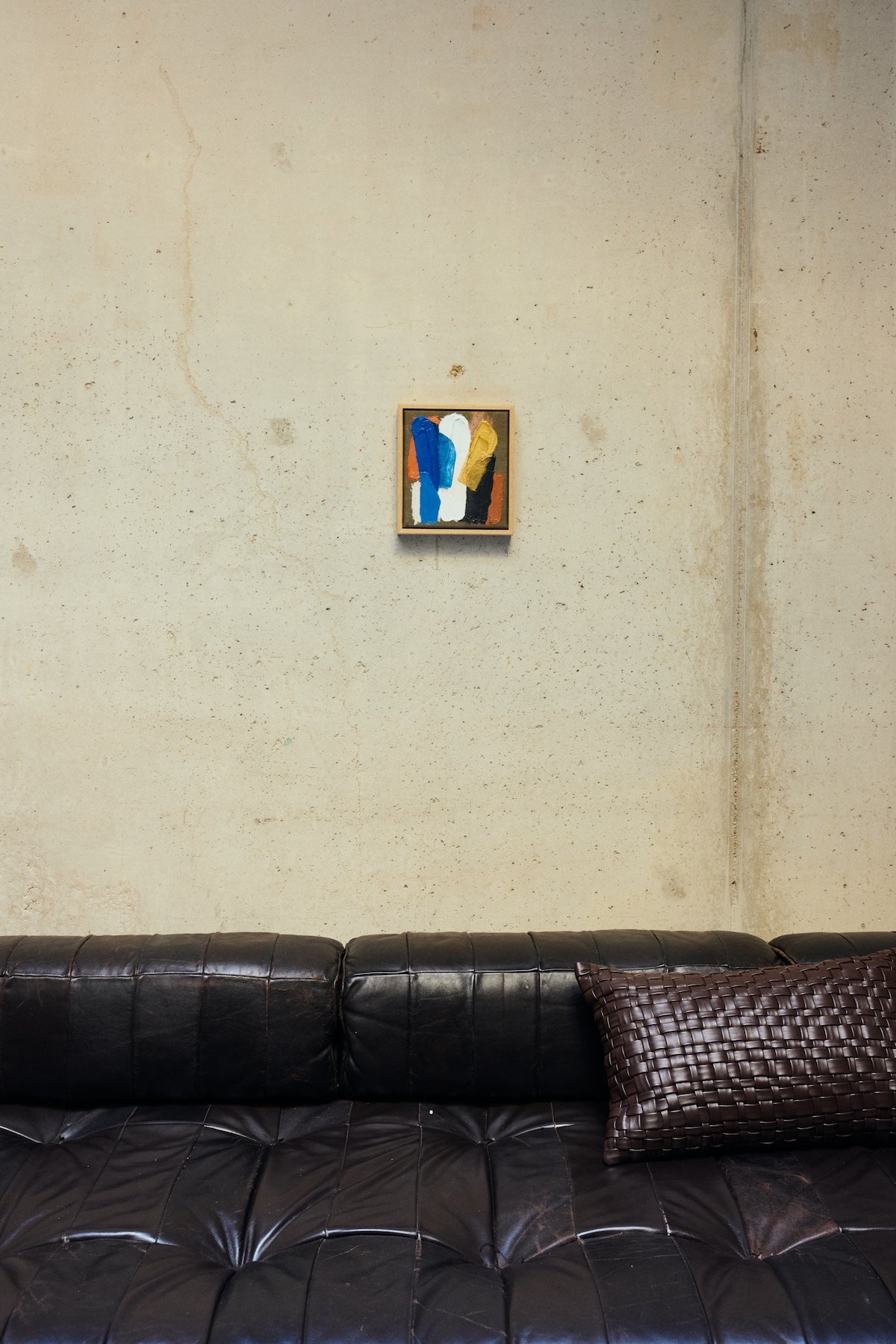 small HKLIVING Moonlight Strokes framed artwork styled above a black leather sofa