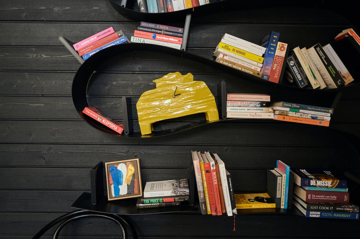 small Moonlight Strokes framed artwork by HKLIVING styled on a black bookcase