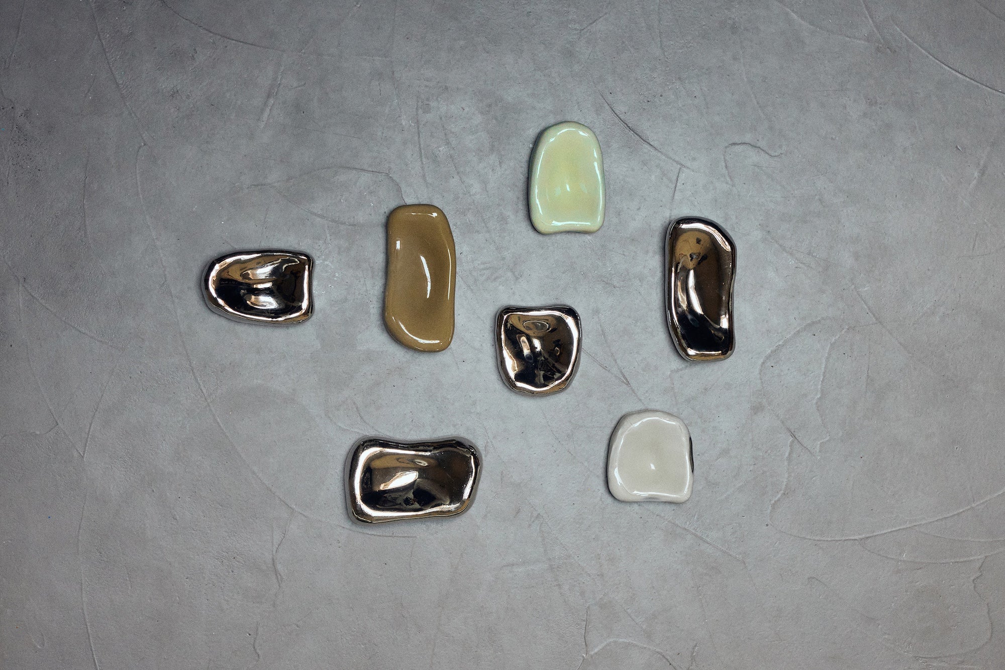HKLIVING Glass Wall Sculpture collection including Cream, Moss, Overcast and Chrome colourways arranged on a concrete surface