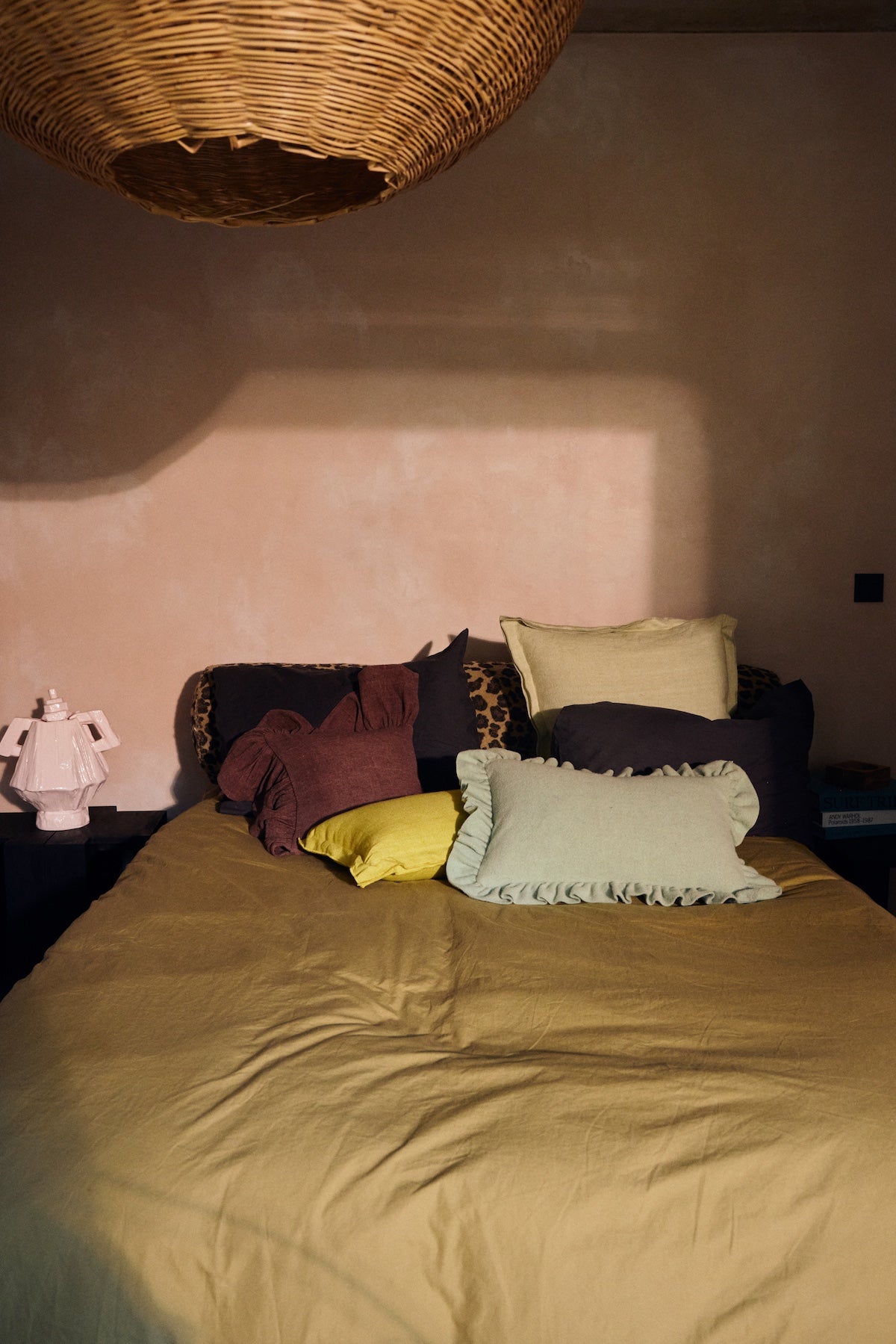 HKLIVING mint felt cushion with ruffled edge styled on a bed with mustard bedding and leopard print bolster
