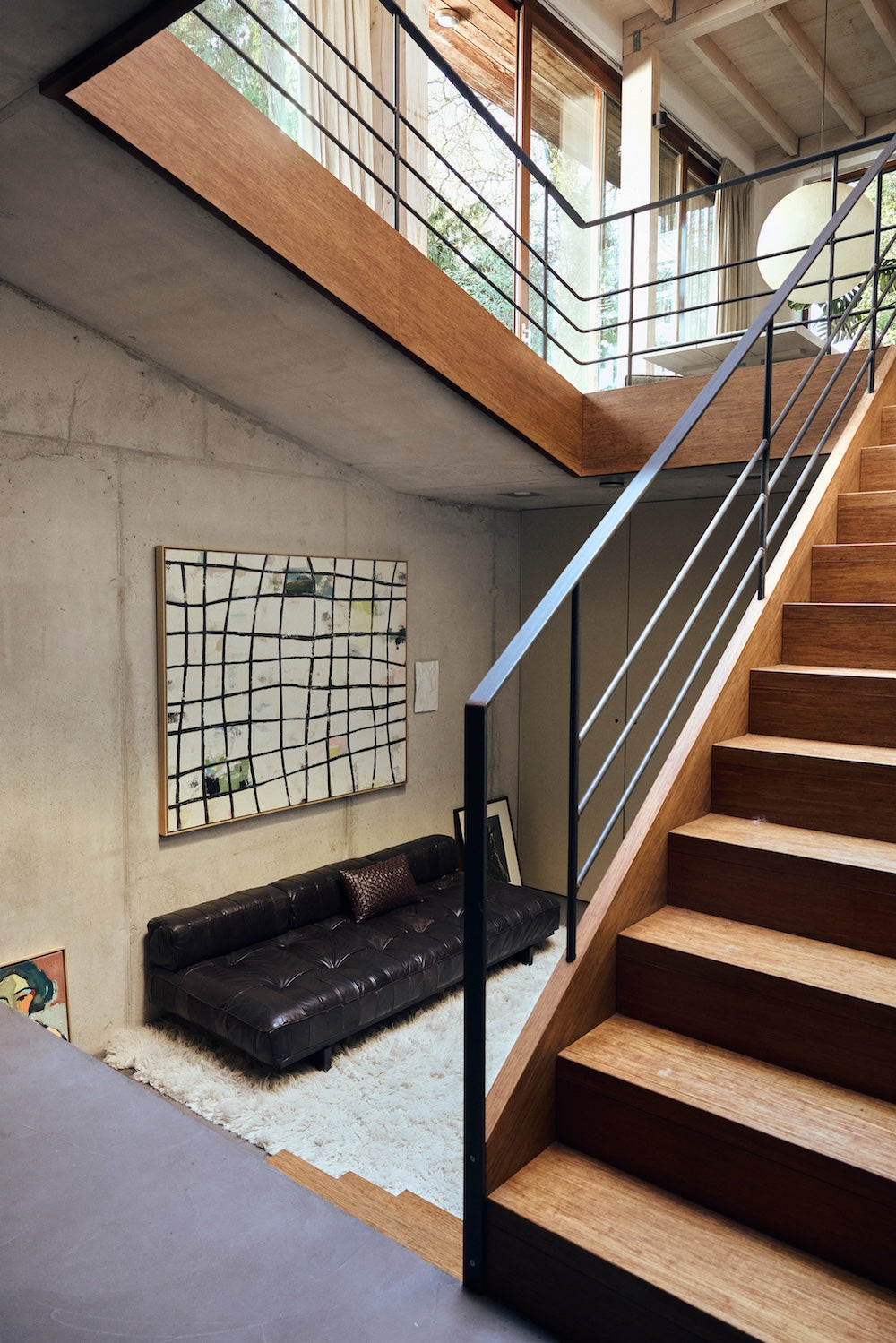 Wired framed canvas wall art by HKLIVING hung on a concrete wall above a leather sofa near a staircase