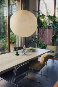 HKLIVING teak cube bowl styled on a dining table beneath a round cream pendant light, with green and clear glass candlesticks