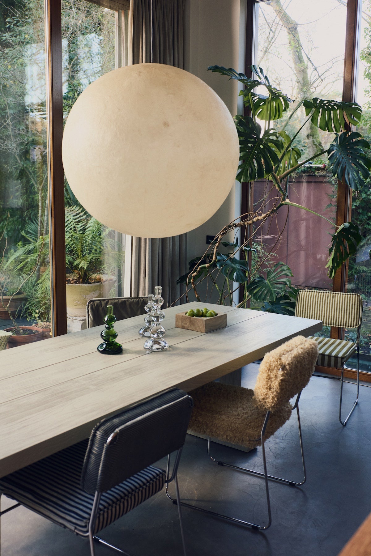 HKLIVING teak cube bowl styled on a dining table beneath a round cream pendant light, with green and clear glass candlesticks