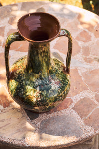 Robust Amphora Vase, Barn by HKLIVING photographed outdoors on a stone table in warm sunlight