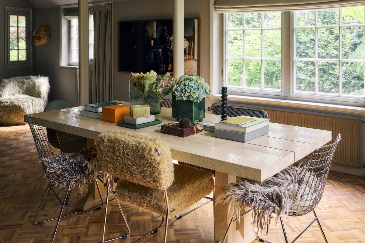 HKLIVING Wire Chair Comfort Kit shaggy cushions styled on Wire Chairs around a dining table, with a matching shaggy armchair in the background