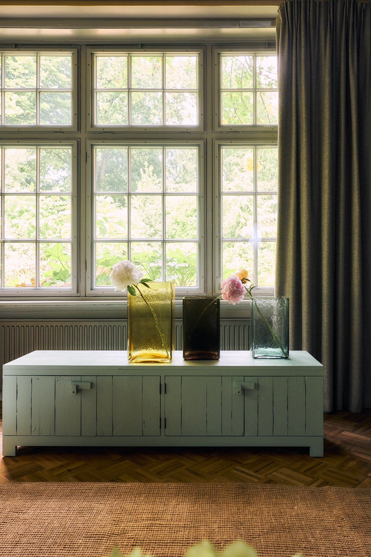 Raw Lowboard in Mint Green by HKLIVING styled in a living room