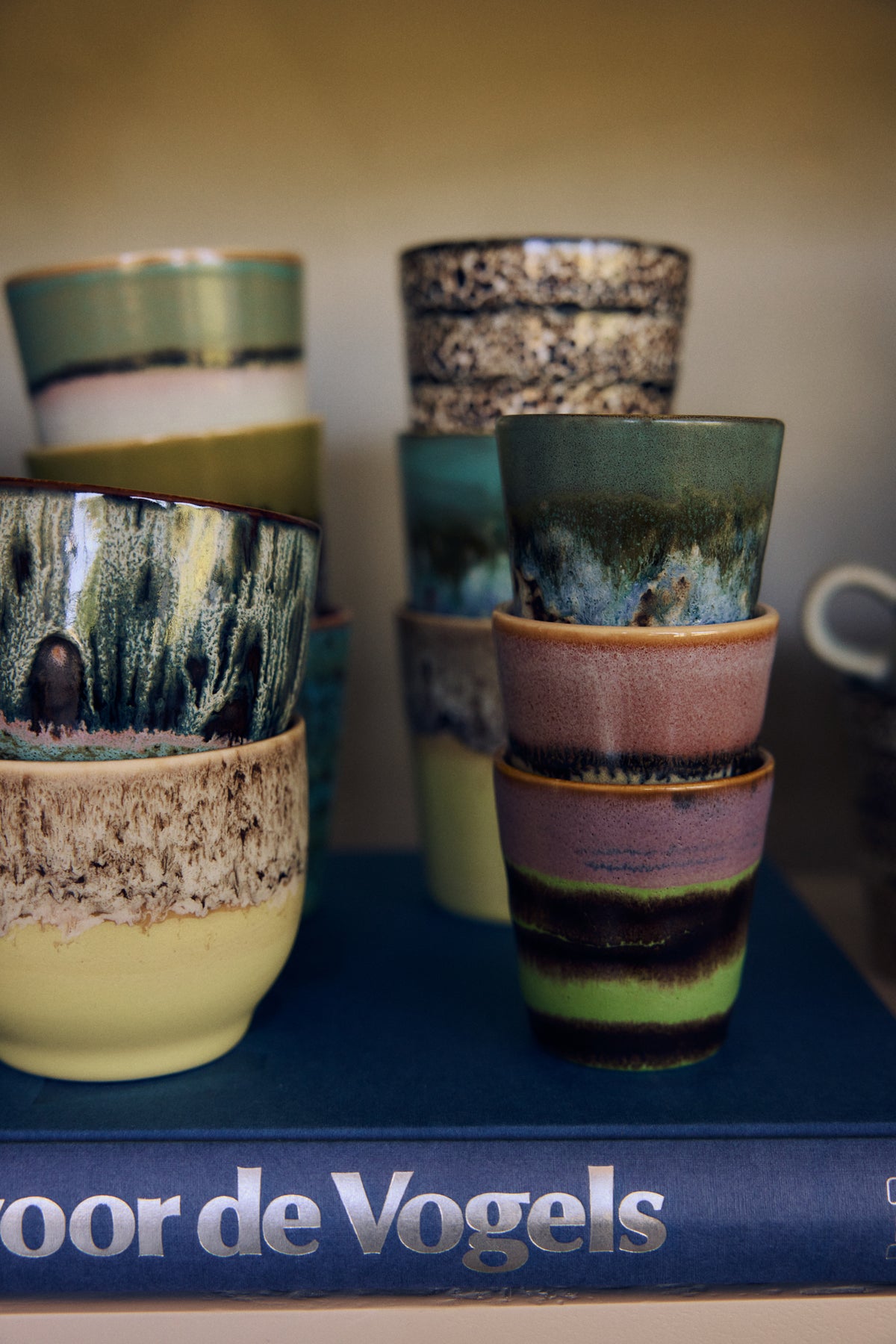 70s Ceramics ristretto mugs in Nostalgia styled in a stack on an open shelf alongside other 70s ceramics pieces